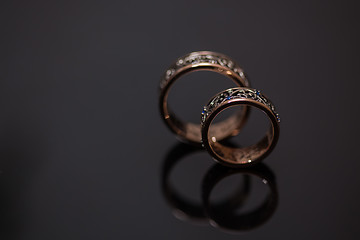 Image showing Two wedding rings in infinity sign. Love concept.