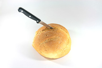 Image showing loaf with knife