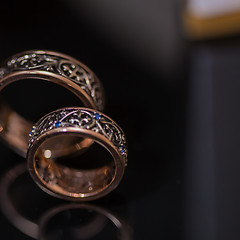 Image showing Two wedding rings in infinity sign. Love concept.