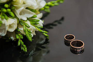 Image showing Two wedding rings in infinity sign. Love concept.