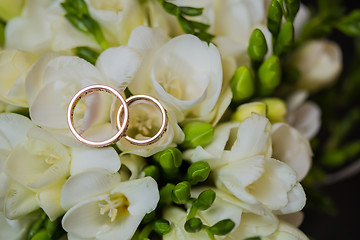 Image showing Two wedding rings in infinity sign. Love concept.