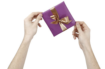 Image showing Young man holding a present