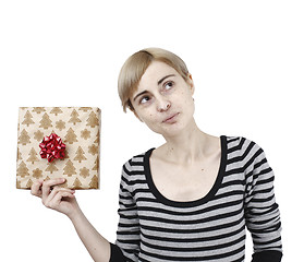 Image showing Young woman holding a present