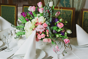 Image showing Beautiful flowers on table