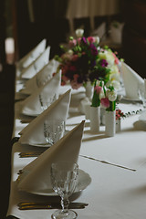 Image showing Beautiful flowers on table