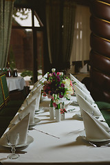 Image showing Beautiful flowers on table