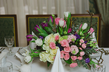 Image showing Beautiful flowers on table