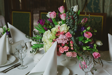 Image showing Beautiful flowers on table