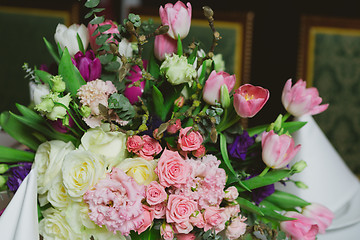 Image showing Beautiful flowers on table