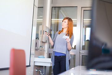 Image showing Businesswoman giving a talk.