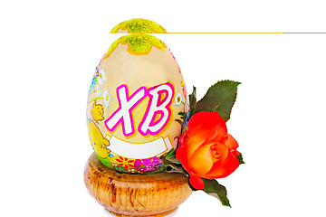 Image showing Easter egg and flower rose among white background.