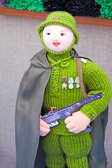 Image showing Crafts: crochet figurine of a female soldier.