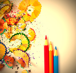 Image showing set of colored pencils and shavings on white background