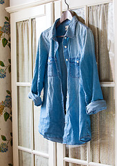 Image showing denim shirt on a hanger