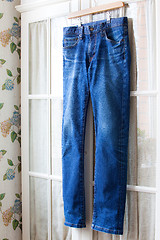 Image showing jeans on hangers