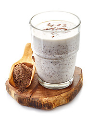 Image showing Glass of yogurt with crushed flax seeds