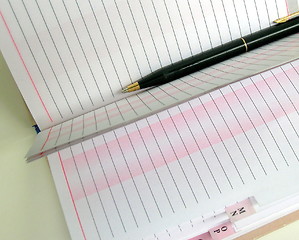 Image showing Pages of Telephone book and black pen