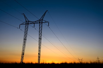 Image showing Large transmission towers at blue hour 