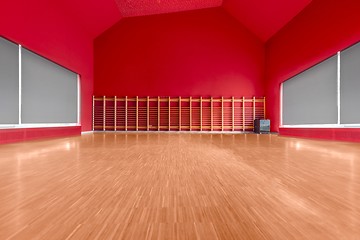 Image showing Gymnasium room with red wall