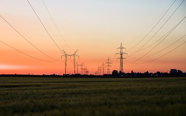 Image showing Large transmission towers at sunset