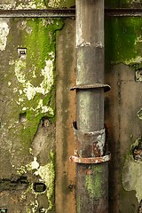 Image showing Old pipes on wall