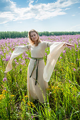 Image showing Pretty sad girl on meadow