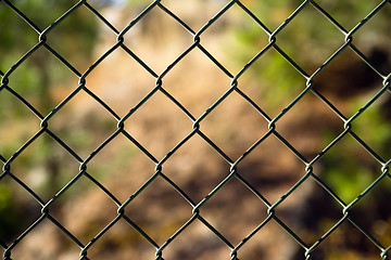 Image showing Diagonal Diamond Pattern Chain Link Fence Outside Boundary