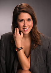 Image showing Attractive Brunette Woman Wearing Only Men's Sport Jacket