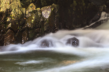 Image showing waterfall and rocks covered with moss