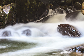 Image showing waterfall and rocks covered with moss