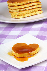 Image showing Mini heart-shaped pancake with syrup