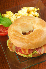 Image showing Bacon and cheese bagel with scrambled eggs