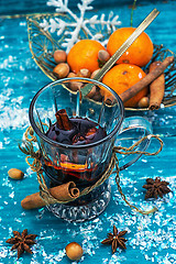 Image showing drink mulled wine on bright blue background.