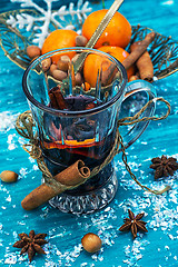 Image showing drink mulled wine on bright blue background.