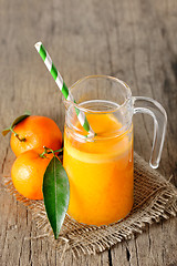 Image showing Clementines and a glass of juice