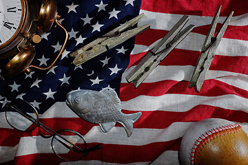 Image showing vintage still life, the American flag, old alarm clock, glasses,