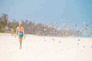 Image showing Woman walking on the beach.