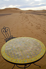 Image showing table and seat in sand