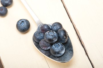 Image showing fresh blueberry on silver spoon