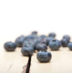 Image showing fresh blueberry on white wood table