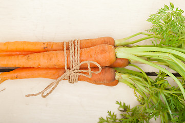 Image showing baby carrots bunch tied with rope