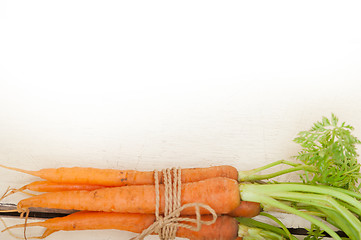 Image showing baby carrots bunch tied with rope