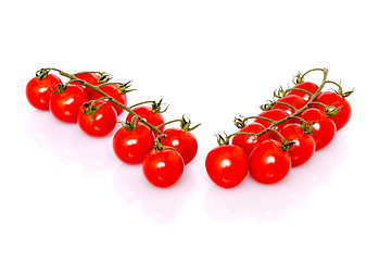 Image showing Fresh ripe cherry tomatoes on white background