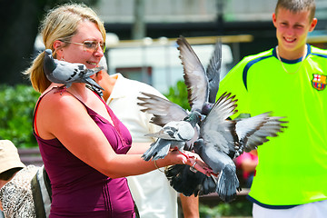 Image showing Woman with pigeons