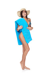 Image showing Full length woman in blue bikini with beach towel