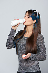 Image showing Healthy woman drinking of dairy produce