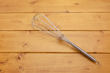 Image showing Metal whisk on a table