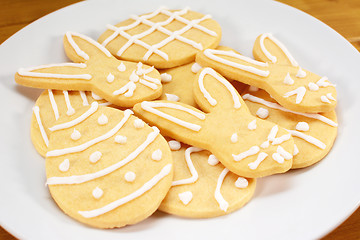 Image showing Heap of frosted Easter biscuits on a plate