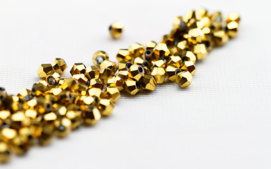 Image showing Golden glass beads