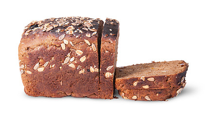 Image showing Half and slices of black unleavened bread with seeds